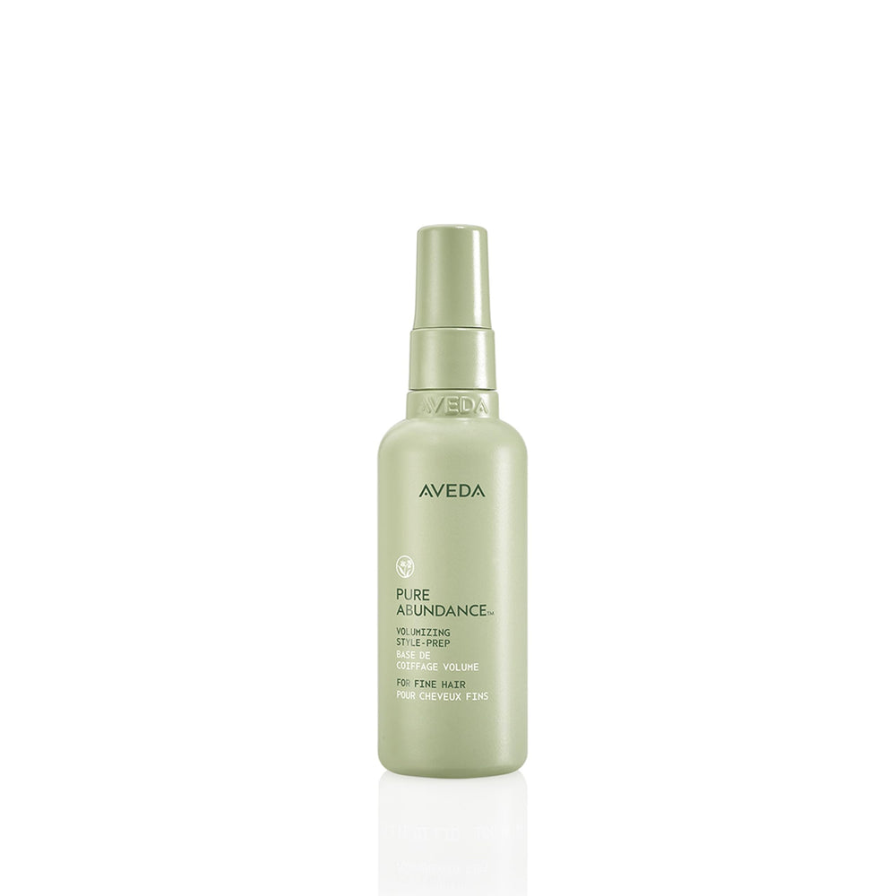 Aveda Pure Abundance bottle front view highlighting the lightweight volumizing formula for fine hair