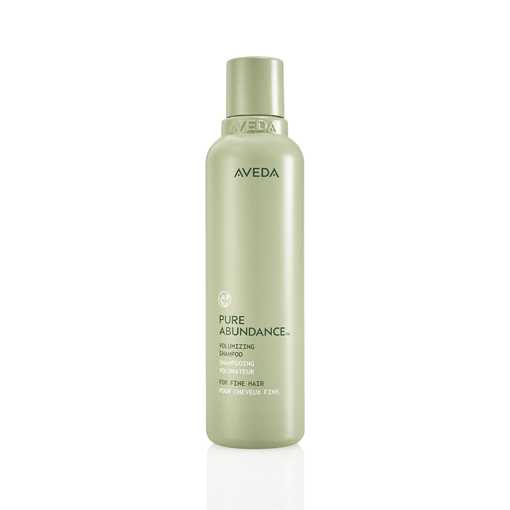 Aveda Pure Abundance shampoo bottle with clear branding.