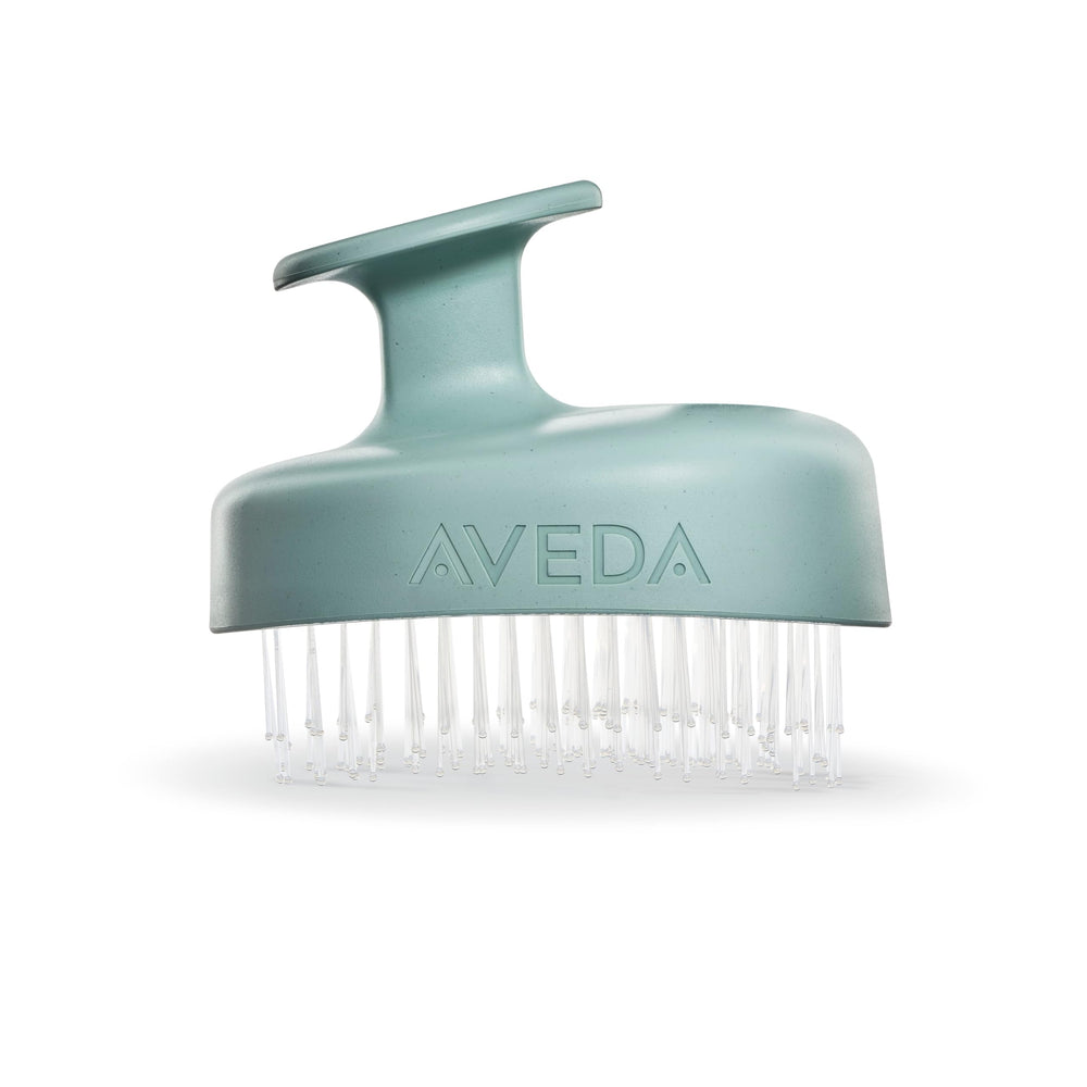 Aveda Scalp Solutions Stimulating Scalp Massager bristles close-up for gentle exfoliation and impurity lift.