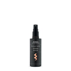 Aveda Texture Tonic bottle close-up showing design and versatile styling
