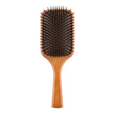 Aveda Wooden Paddle Brush detangles hair with extended bristles.