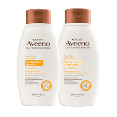 Aveeno Apple Cider Vinegar Shampoo bottle pour clarifying scalp.