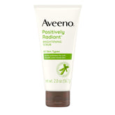 Aveeno Positively Radiant face scrub tube shown for daily cleansing and exfoliation.