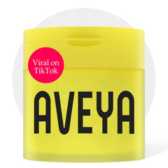 AVEYA Dark Spot Pads jar closeup showing hydrated skin potential