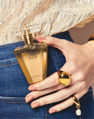 AVON Rare Gold amber glow close-up emphasizes warm golden amber notes.
