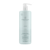 Paul Mitchell Awapuhi Wild Ginger Cream Rinse bottle on shelf, color safe conditioner for damaged hair.