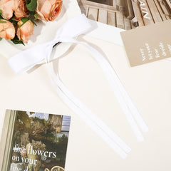 Ayesha white bow clips provide sturdy grip for busy daily hairstyles.