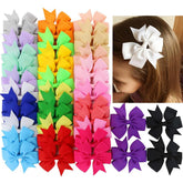 Babymatch pinwheel bow with alligator clip for toddlers, secure daily wear.