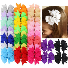 Babymatch pinwheel bow with alligator clip for toddlers, secure daily wear.