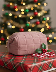 BAGSMART makeup bag in dark pink with roomy interior for lipstick and brushes.