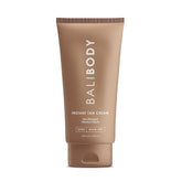 Bali Body Instant Tan Cream jar showing smooth, even tan color on skin.