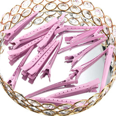 Bantoye pink clip securing hair during styling for curling or blow-drying.