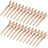 Bantoye rose gold duck bill clip closeup for clean sectioning during styling.