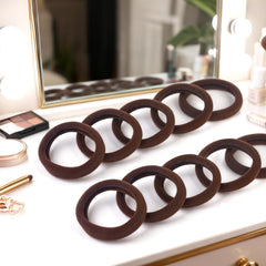 BAOLI 100pcs brown hair ties in pearly bag for easy storage.