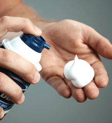 Barbasol foam next to razor for a precise, comfortable shave.
