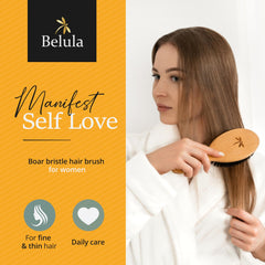 Belula Long Pins Detangling Brush eases knots in long or curly hair.