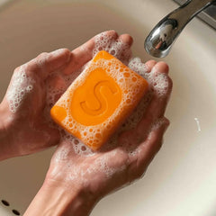 BIJIELAODIAO persimmon soap used on face and body shows versatile cleansing.