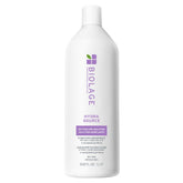 Biolage Hydra Source Detangling bottle pour showing easy dispense for instant hydration.