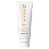 Biolage Smooth Proof Conditioner bottle pouring detangles frizzy hair.