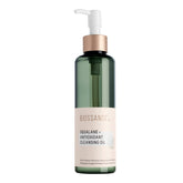 Biossance Squalane + Antioxidant Cleansing Oil bottle on a vanity for makeup removal