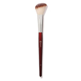 BK BEAUTY 112 small angled face brush held for precise blush placement.