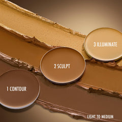 Applying contour cream from Black Radiance palette to cheeks for natural lift and shape.