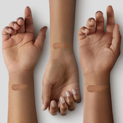 Concealer spread on the cheek for even skin tone with Black Radiance