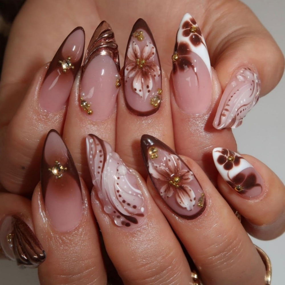 BLGTGH French tips almond nails with flower accents for a chic everyday look.