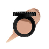 Bobbi Brown Corrector bottle closeup showing creamy color-correcting formula for under-eye use.