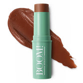 Boomstick Bronze application on the cheek for natural warmth and lift.