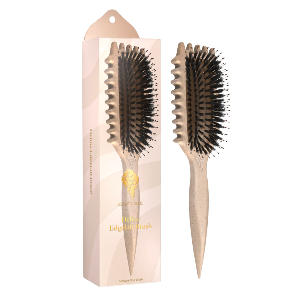 Bounce Curl Define EdgeLift Brush closeup shows vegan bristles for smooth curls.