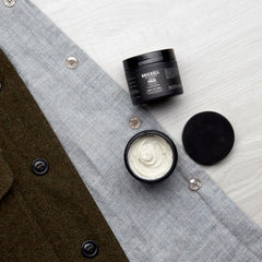Brickell pomade in hand for pliable matte styling