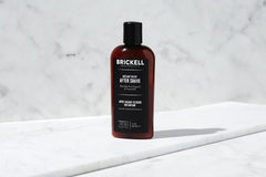 Brickell Instant Relief Aftershave label close-up emphasizes natural ingredients for sensitive skin