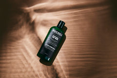 Close-up of foam from Brickell charcoal face wash for pore cleansing.