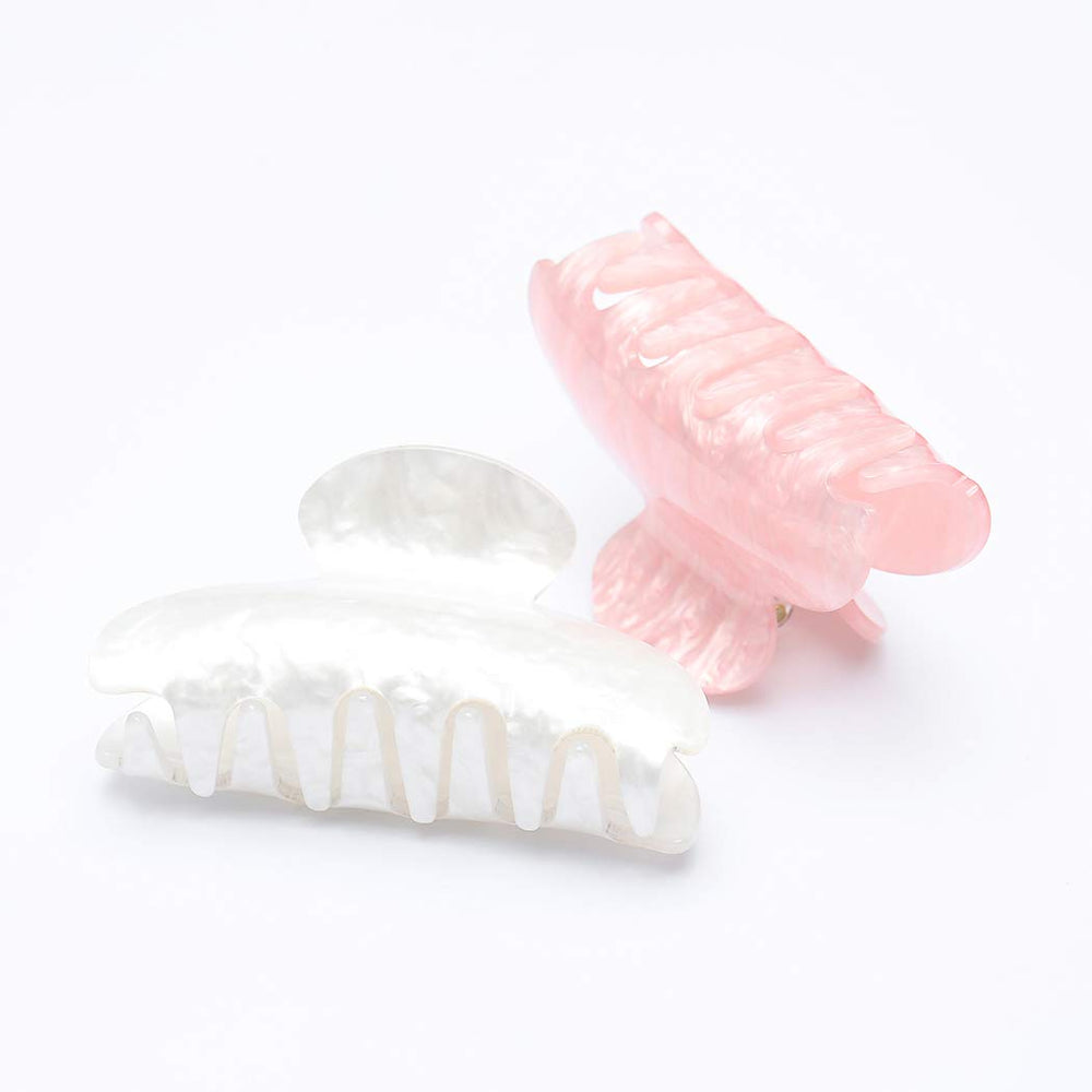 Brinie pink 8cm hair claw close-up showing sturdy grip and stylish color.