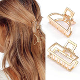 Brinie gold arch-design hair clip securely holds hair without snagging.