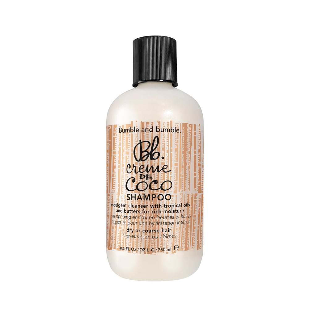 Bumble and bumble Creme De Coco shampoo bottle close-up showing moisture benefits.