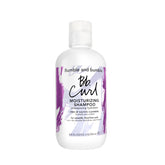 Bumble and bumble Curl Moisturizing Shampoo bottle front view highlighting hydration for curls.