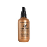 Bumble and bumble Heat Shield mist bottle pour shows easy heat protection.