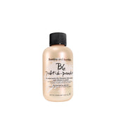 Bumble and bumble Pret-A-Powder bottle pouring to absorb oil for refreshed style.
