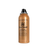 Bumble and bumble Heat Shield bottle in front, ready to protect hair during styling.