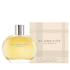Burberry Classic EDP cap and flacon bathed in warm light