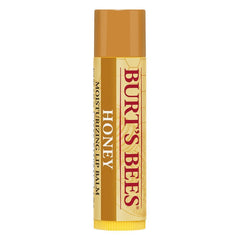 Burt's Bees Honey Moisturizing Lip Balm tube applying hydration for dry lips.