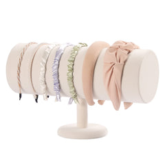 ByKen T-bar headband holder in beige velvet keeps headbands neatly organized on the dresser.
