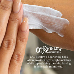 Hands apply Bergamot lotion for quick hydration and smoothing.