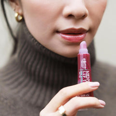 C.O. Bigelow Plum Mentha Lip Tint glossy shine enhances lips with peppermint freshness.