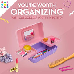 Caboodles Pretty in Petite opened to reveal swivel trays for organized makeup.