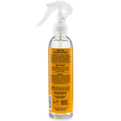 Camille Rose Curl and Detangler Spray mist on curls delivering moisture.