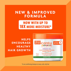 Cantu Argan Oil Leave-In Cream close-up texture shows creamy formula.