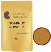 Carmel Organics Soapnut powder bottle close-up, highlighting gentle cleansing for hair care.